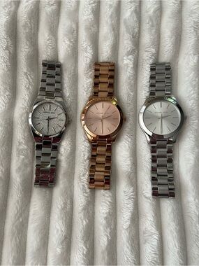 Michael Kors Women’s Silver and Rose Gold Stainless Steel Watches